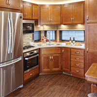 Custom RV kitchen from New Horizons in solid oak