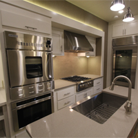 Custom RV kitchen from New Horizons in all white with custom appliances